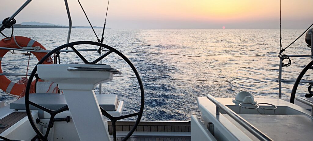 Balearics private sailing — Daybreak at the helm, off Porto Cristo