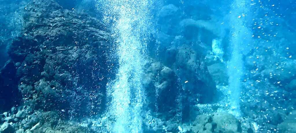 Volcanic fumaroles bubbling underwater off Panarea, a snorkelling stop in the Aeolian Islands