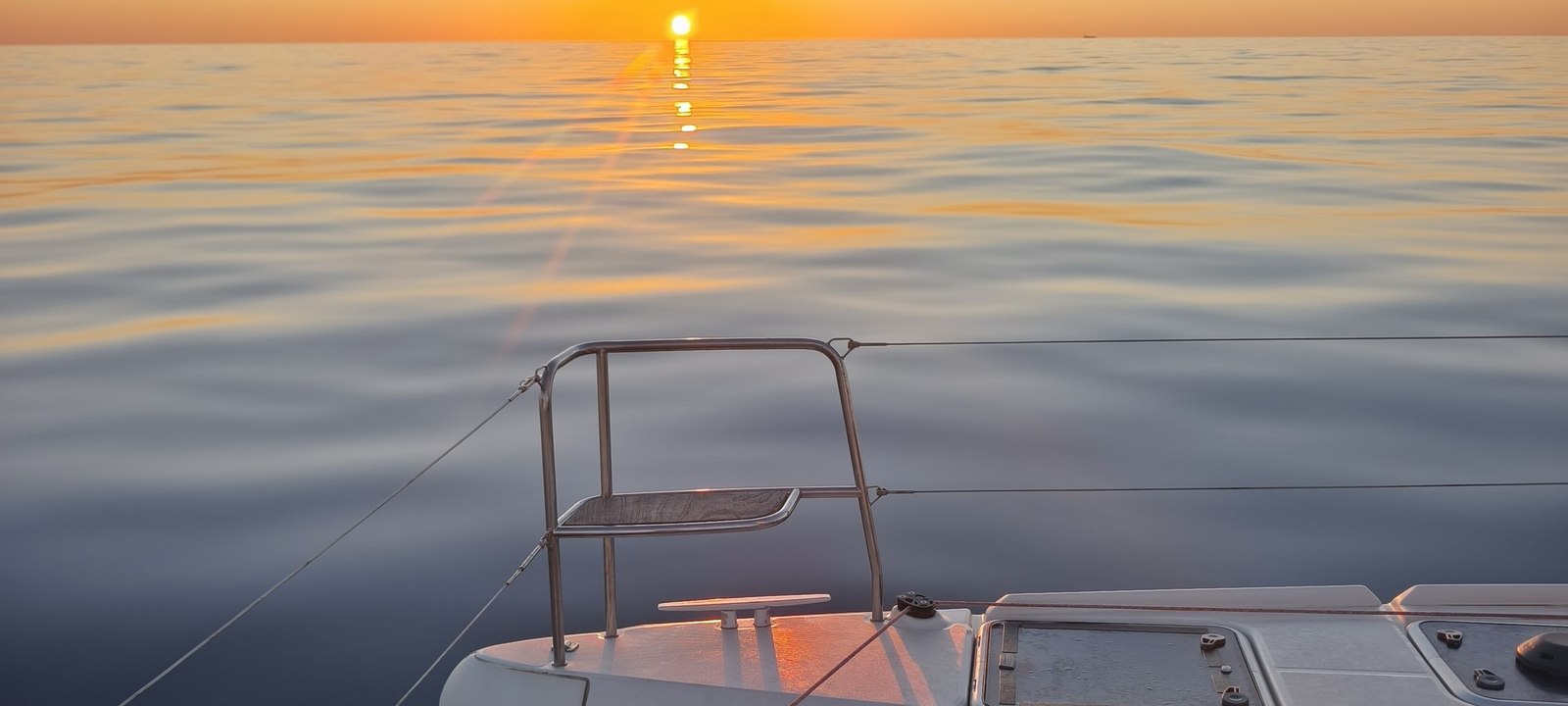 Sunrise from the bow of a catamaran