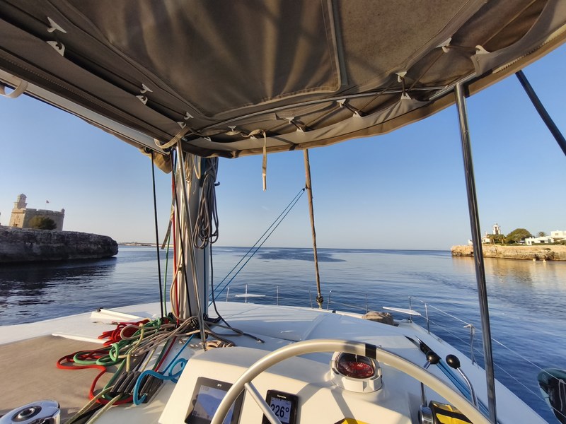 Leaving the Ciutadella canal at first light, from the helm