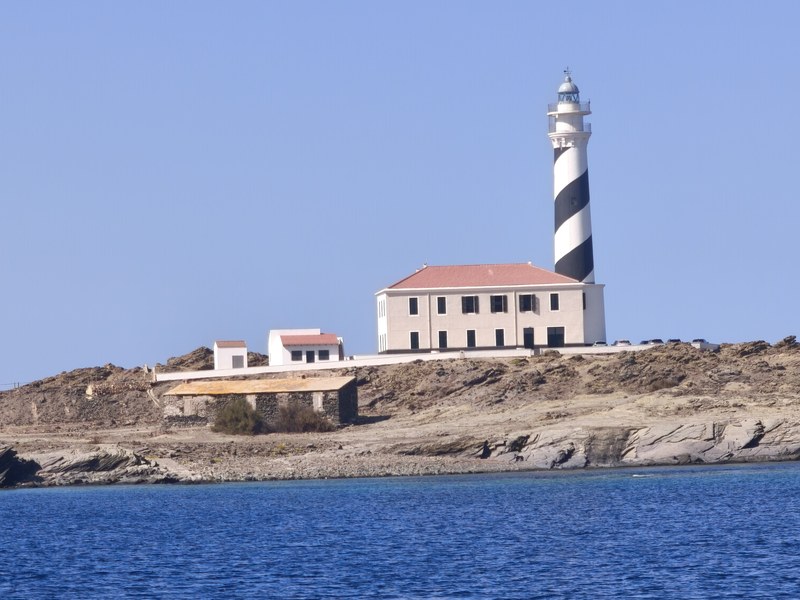 The Favaritx lighthouse and its keeper's house, seen from the sea