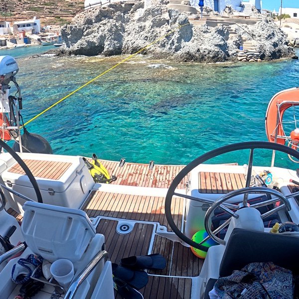 The white chapel on its rock at Goupa Kara, Kimolos, seen from the cockpit at anchor