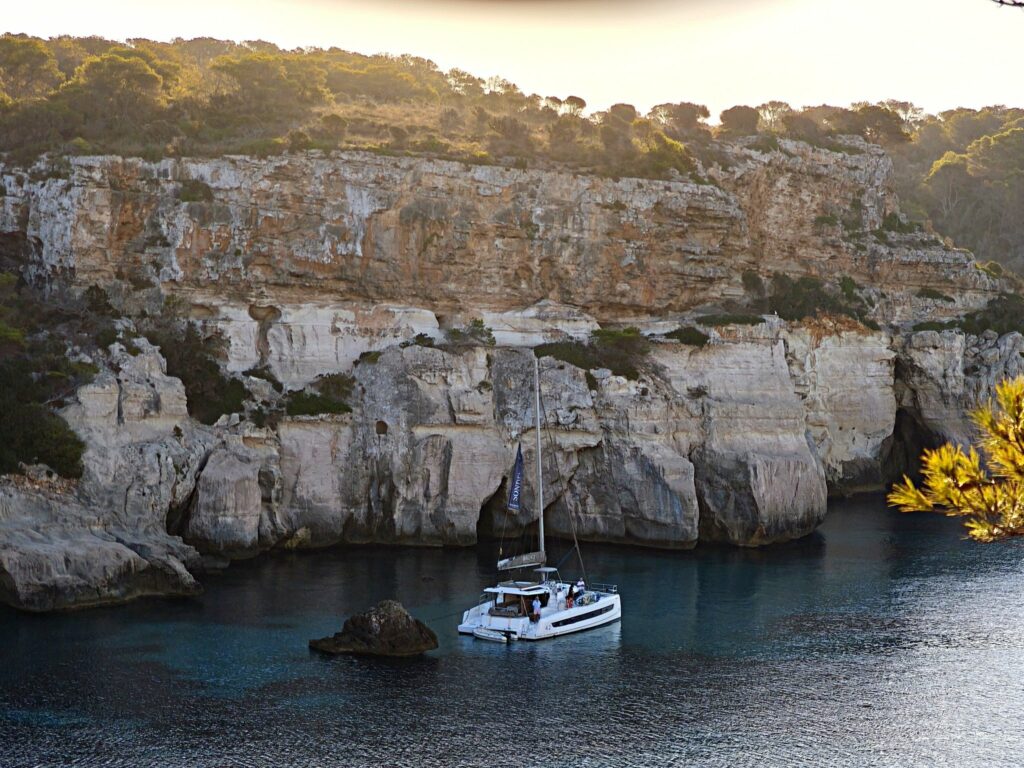 The Quiet Passage Menorca — Alone at anchor in Cala Macarella, at first light